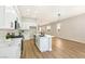 Contemporary kitchen with white cabinetry, stainless steel appliances, and a large center island at 10017 Snow Crest Pl, Las Vegas, NV 89134