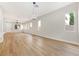 Spacious living room offers wood floors, recessed lights, and multiple windows at 10017 Snow Crest Pl, Las Vegas, NV 89134