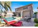 Backyard with a pool and patio seating for outdoor living at 10046 Floragold Ct, Las Vegas, NV 89147