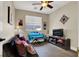 Cozy bedroom offers a comfortable space with a ceiling fan and window view at 10046 Floragold Ct, Las Vegas, NV 89147