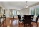 Spacious dining room with hardwood floors, chandelier lighting, and natural light at 10046 Floragold Ct, Las Vegas, NV 89147