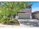 Charming two-story home features a well-manicured lawn and attached two car garage at 10046 Floragold Ct, Las Vegas, NV 89147