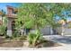 Charming two-story home with desert landscaping and attached two car garage at 10046 Floragold Ct, Las Vegas, NV 89147