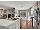 Bright kitchen overlooking the pool with white countertops and stainless steel appliances at 10046 Floragold Ct, Las Vegas, NV 89147