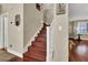 Elegant staircase with wood treads and white risers leads to upper level at 10046 Floragold Ct, Las Vegas, NV 89147