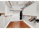 Spacious walk-in closet with ample storage space and wooden floors, providing a luxurious and organized feel at 10046 Floragold Ct, Las Vegas, NV 89147