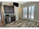 Bedroom with built-in wet bar, and shuttered windows providing ample natural light at 10149 Terrastone Dr, Las Vegas, NV 89148