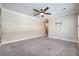 Large bedroom with plush carpeting, neutral walls, and ceiling fan at 10149 Terrastone Dr, Las Vegas, NV 89148