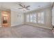 Bedroom featuring carpet, ceiling fan and ensuite bathroom at 10149 Terrastone Dr, Las Vegas, NV 89148