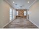 Inviting dining room featuring hardwood floors, plantation shutters and a decorative light fixture at 10149 Terrastone Dr, Las Vegas, NV 89148