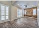 Elegant dining room featuring hardwood floors, plantation shutters, and modern lighting at 10149 Terrastone Dr, Las Vegas, NV 89148