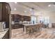 Modern kitchen featuring a large island with seating, stainless steel appliances, and ample cabinets at 10149 Terrastone Dr, Las Vegas, NV 89148