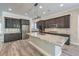 Modern kitchen with granite countertops, stainless appliances, and a spacious center island at 10149 Terrastone Dr, Las Vegas, NV 89148