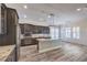 Gourmet kitchen with granite countertops, stainless appliances, and stylish pendant lighting at 10149 Terrastone Dr, Las Vegas, NV 89148