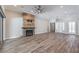 Bright and airy living room with a fireplace, wood accent wall, and lots of natural light at 10149 Terrastone Dr, Las Vegas, NV 89148
