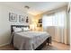 Cozy bedroom featuring plush bedding, natural light, and tasteful decor, creating a serene atmosphere at 10254 Martinsburg Ct, Las Vegas, NV 89183
