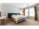 Comfortable bedroom with a plush bed, accent lighting, and natural light, perfect for relaxation at 10254 Martinsburg Ct, Las Vegas, NV 89183