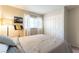 Comfortable bedroom featuring plush bedding, natural light, creating a serene atmosphere at 10254 Martinsburg Ct, Las Vegas, NV 89183