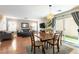 Open dining area with a view of the living room and sliding doors to the backyard at 10254 Martinsburg Ct, Las Vegas, NV 89183