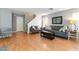 Comfortable living room with modern furniture, wood floors, and neutral decor at 10254 Martinsburg Ct, Las Vegas, NV 89183