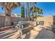 Outdoor spa and BBQ area in a private backyard setting, perfect for relaxing and grilling at 10310 Songsparrow Ct, Las Vegas, NV 89135