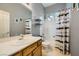 Bathroom featuring a single vanity, tub shower, and modern fixtures for a clean, functional space at 10310 Songsparrow Ct, Las Vegas, NV 89135