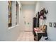 Open and airy entryway featuring tile floors, neutral paint, and a coat rack at 10310 Songsparrow Ct, Las Vegas, NV 89135