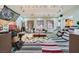 Spacious living room with unique decor, natural light, and ample seating at 10310 Songsparrow Ct, Las Vegas, NV 89135