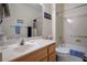 Bathroom featuring a shower-tub combo, bright vanity with a single sink, and essential decor at 10720 Sky Meadows Ave, Las Vegas, NV 89134