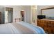 Bedroom featuring an ensuite bathroom, walk-in closet, and light walls at 10720 Sky Meadows Ave, Las Vegas, NV 89134