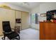 Spare room with built in wall bed, chair and window at 10720 Sky Meadows Ave, Las Vegas, NV 89134