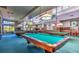 Elegant billiards room with multiple pool tables and pendant lighting at 10720 Sky Meadows Ave, Las Vegas, NV 89134