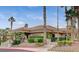 Exterior of the clubhouse with a tiled roof, lush landscaping, and inviting entrance at 10720 Sky Meadows Ave, Las Vegas, NV 89134