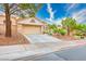 Charming single-story home featuring a well-maintained front yard and attached two-car garage at 10720 Sky Meadows Ave, Las Vegas, NV 89134