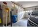 Garage with storage cabinets, garage door, and vehicle at 10720 Sky Meadows Ave, Las Vegas, NV 89134