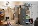 Cluttered garage interior with work and laundry area at 10720 Sky Meadows Ave, Las Vegas, NV 89134