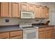 Functional kitchen features a clean design, updated appliances, and ample counter space, perfect for cooking at 10720 Sky Meadows Ave, Las Vegas, NV 89134
