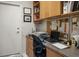 Office with built-in wood desk and shelving, ample storage, and natural light at 10720 Sky Meadows Ave, Las Vegas, NV 89134