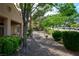Beautifully landscaped side yard with mature trees and decorative rock at 10720 Sky Meadows Ave, Las Vegas, NV 89134