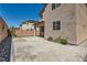 Backyard with pavers, artificial turf, and desert landscaping at 10744 Yarmouth Bay Ct, Las Vegas, NV 89179