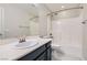Bathroom features a single sink vanity and a shower-tub combo with white tiled walls at 10744 Yarmouth Bay Ct, Las Vegas, NV 89179