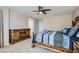 Spacious bedroom featuring a well-crafted bedframe and ample natural light from a bright window at 10744 Yarmouth Bay Ct, Las Vegas, NV 89179