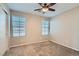 Bedroom with dual windows offering ample natural light and closet storage at 10744 Yarmouth Bay Ct, Las Vegas, NV 89179