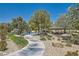 Community park featuring a playground, picnic shelter, walking path, and landscaping at 10744 Yarmouth Bay Ct, Las Vegas, NV 89179