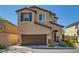 Charming two-story home featuring a two-car garage, well-maintained landscaping, and inviting front entrance at 10744 Yarmouth Bay Ct, Las Vegas, NV 89179