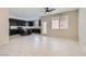Open-concept living area featuring modern tile flooring, neutral walls, and a smooth flow into the kitchen at 10744 Yarmouth Bay Ct, Las Vegas, NV 89179