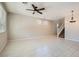 Bright living room featuring modern tile flooring, neutral walls, and plenty of natural light at 10744 Yarmouth Bay Ct, Las Vegas, NV 89179