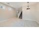 Spacious living room with tiled floors and a staircase to the upper level at 10744 Yarmouth Bay Ct, Las Vegas, NV 89179