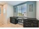 Bright office features modern built-in desk, stylish decor, and large window at 10744 Yarmouth Bay Ct, Las Vegas, NV 89179