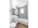 Modern bathroom featuring a gray tiled shower/tub combination and a white vanity at 1121 W Monroe Ave, Las Vegas, NV 89106